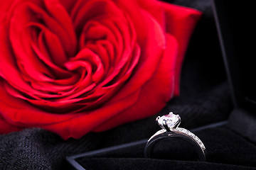 Image showing red rose and diamond ring in a box 