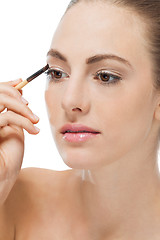 Image showing doing the makeup brown eyeshadow on beautiful eyes