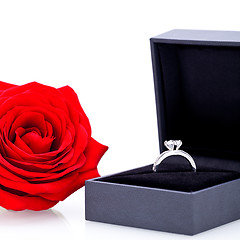 Image showing Engagement ring with a bunch of red roses