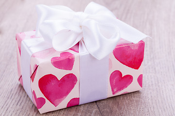 Image showing Pretty Valentines gift with hearts on the giftwrap