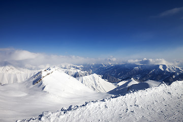 Image showing Snowy mountains and off-piste slope at nice day