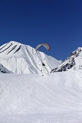 Image showing Skydiver landing on ski slope