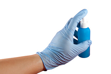 Image showing Hand with glove pressing spray can