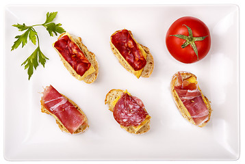 Image showing thin slices of Iberian sausage omelette with bread