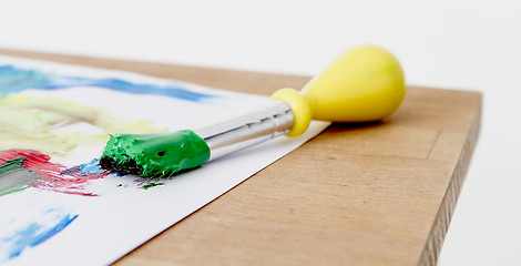 Image showing green paint with brush