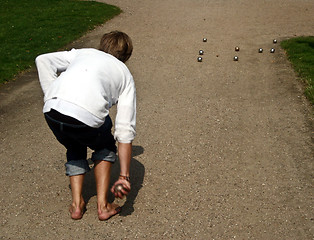 Image showing Boy playing petanque