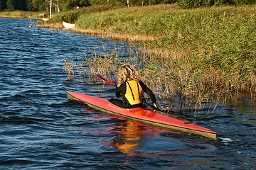 Image showing Blond girl on a kayak on a lake in Denmark