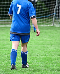 Image showing Football player in blue without head