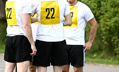 Image showing Sport people with number on the back