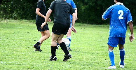 Image showing Football player in blue without head