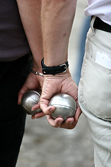 Image showing Petanque players arms