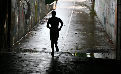 Image showing People jogging in a city