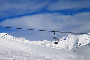 Image showing Chair lift and off-piste slope at nice day