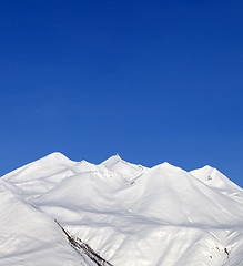 Image showing Snowy mountains and blue sky