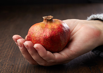 Image showing Pomegranate in a hand