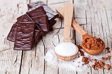 Image showing chocolate sweets, cocoa powder and sugar