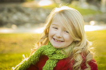 Image showing Little Girl Wearing Winter Coat and Scarf at the Park
