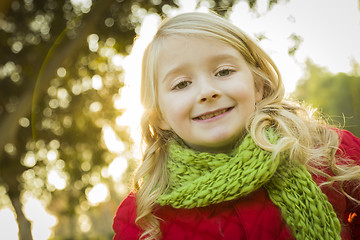 Image showing Little Girl Wearing Winter Coat and Scarf at the Park
