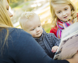 Image showing Mother Reading a Book to Her Two Adorable Blonde Children
