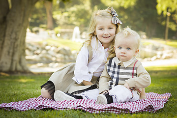 Image showing Sweet Little Girl with Her Baby Brother at the Park
