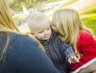 Image showing Mother Reading a Book to Her Two Adorable Blonde Children
