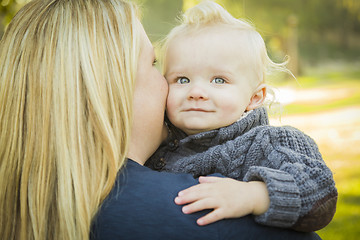 Image showing Mother Embracing Her Adorable Blonde Baby Boy
