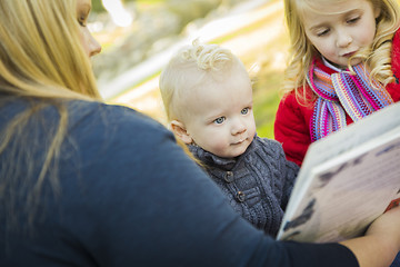 Image showing Mother Reading a Book to Her Two Adorable Blonde Children
