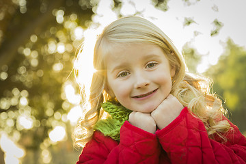 Image showing Little Girl Wearing Winter Coat and Scarf at the Park
