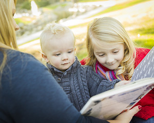 Image showing Mother Reading a Book to Her Two Adorable Blonde Children
