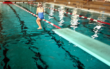 Image showing Girl jumpimg at the pool