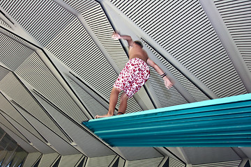Image showing Boy jumpimg at the pool