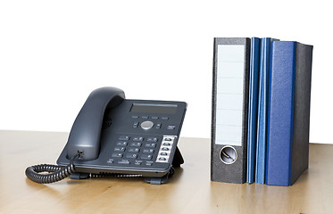 Image showing modern business phone with ring binder