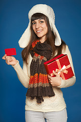 Image showing Winter woman with red gift box and credit card