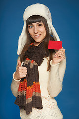 Image showing Winter woman holding credit card