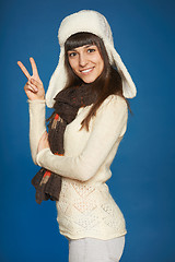 Image showing Winter girl showing victory sign