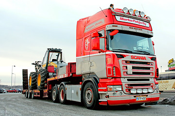 Image showing Scania Truck Hauling a Forest Harvester 