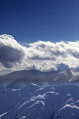 Image showing Evening mountains and sunlight clouds