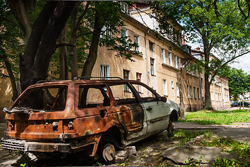 Image showing Residental house and burned-down vehicle