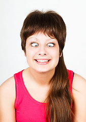 Image showing cross eyed squinting expression girl