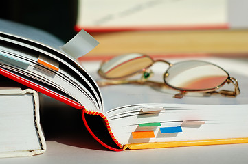 Image showing Opened book and glasses