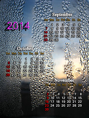 Image showing calendar for autumn of 2014 year with water drops