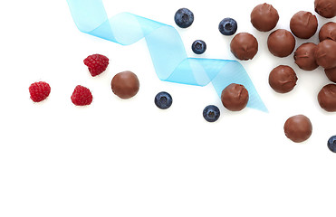 Image showing Chocolate praline and fresh berries