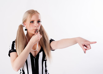 Image showing Football referee whistling and pointing to side