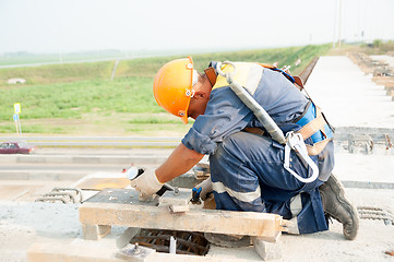 Image showing Worker on bridge