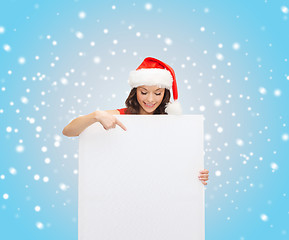 Image showing woman in santa helper hat with blank white board