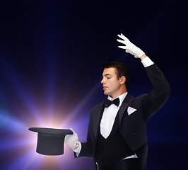 Image showing magician in top hat showing trick