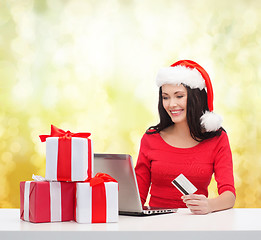 Image showing woman with gifts, laptop computer and credit card