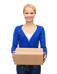 Image showing smiling woman in casual clothes with parcel box