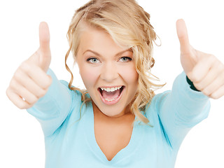 Image showing young businesswoman with thumbs up