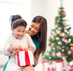 Image showing happy mother and child girl with gift box